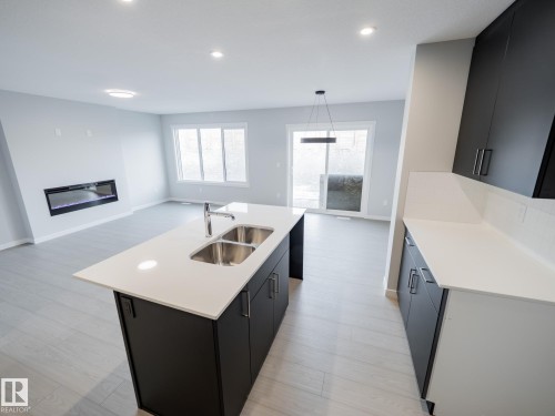 346 172 Avenue, Edmonton, AB - Indoor Photo Showing Kitchen With Fireplace With Double Sink