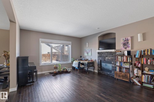 106 Hilldowns Drive, Spruce Grove, AB - Indoor Photo Showing Living Room With Fireplace
