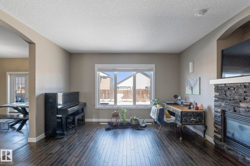106 Hilldowns Drive, Spruce Grove, AB - Indoor Photo Showing Living Room With Fireplace