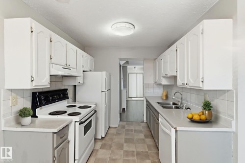 1 2020 105 Street, Edmonton, AB - Indoor Photo Showing Kitchen With Double Sink