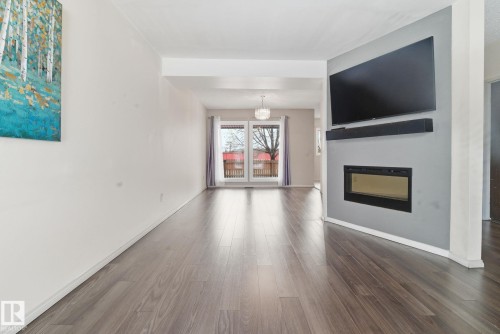 1 2020 105 Street, Edmonton, AB - Indoor Photo Showing Living Room With Fireplace