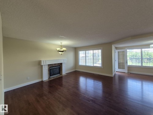 8361 Shaske Crescent, Edmonton, AB - Indoor Photo Showing Living Room With Fireplace