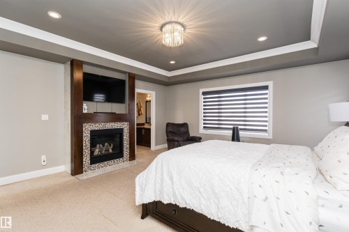 2410 Ashcraft Crescent, Edmonton, AB - Indoor Photo Showing Bedroom With Fireplace