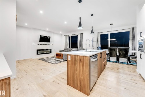6205 46 Avenue, Beaumont, AB - Indoor Photo Showing Kitchen With Fireplace