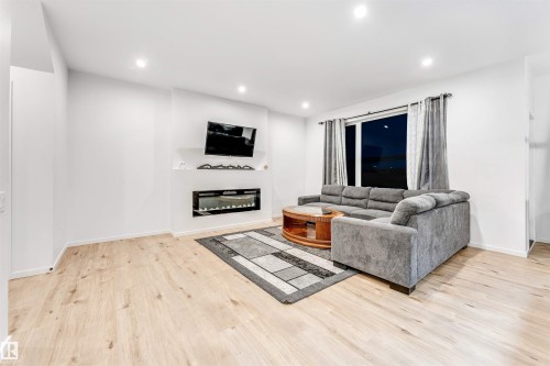 6205 46 Avenue, Beaumont, AB - Indoor Photo Showing Living Room With Fireplace