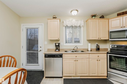 10105 105 Street, Morinville, AB - Indoor Photo Showing Kitchen With Double Sink