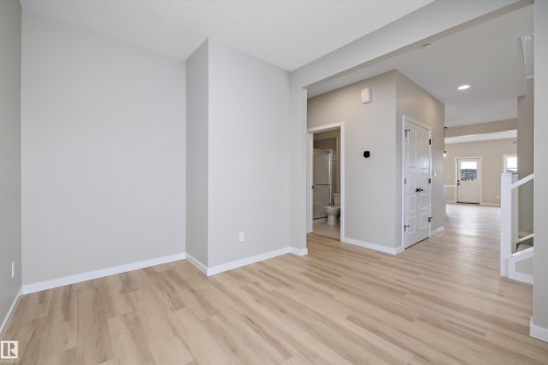 Unfurnished room with light wood finished floors and recessed lighting - 4544 Kinsella Link, Edmonton, AB - Indoor Photo Showing Other Room