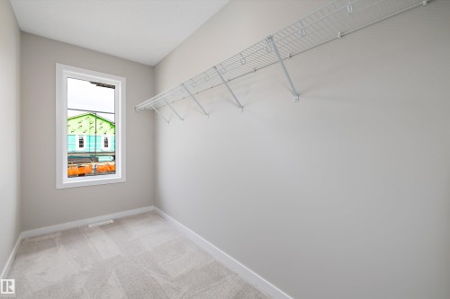 Spacious closet with light colored carpet - 4544 Kinsella Link, Edmonton, AB - Indoor