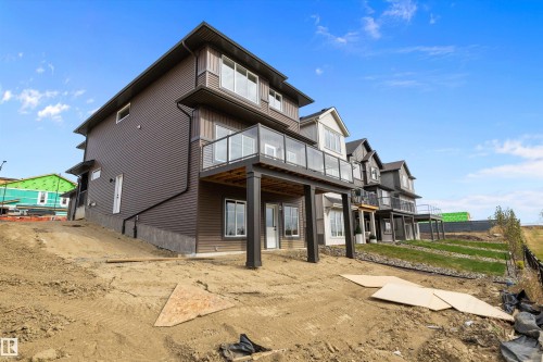 Back of property featuring a deck and a patio area - 4544 Kinsella Link, Edmonton, AB - Outdoor