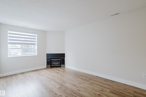 506 9919 105 Street, Edmonton, AB - Indoor Photo Showing Living Room With Fireplace
