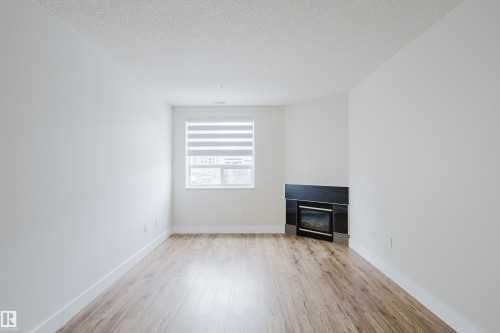 506 9919 105 Street, Edmonton, AB - Indoor With Fireplace