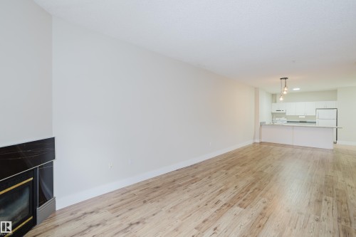506 9919 105 Street, Edmonton, AB - Indoor Photo Showing Living Room With Fireplace