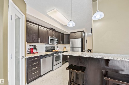 201 9707 106 Street, Edmonton, AB - Indoor Photo Showing Kitchen With Stainless Steel Kitchen With Upgraded Kitchen