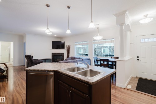 98 7293 South Terwillegar Drive, Edmonton, AB - Indoor Photo Showing Kitchen With Fireplace With Double Sink