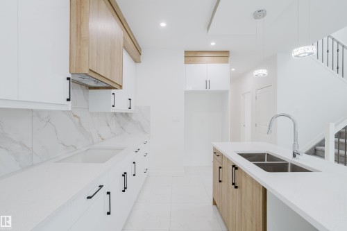 942 18 Avenue, Edmonton, AB - Indoor Photo Showing Kitchen With Double Sink