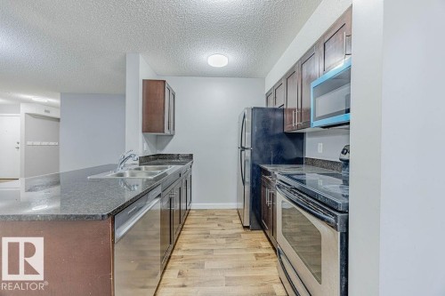 219 530 Watt Boulevard, Edmonton, AB - Indoor Photo Showing Kitchen With Stainless Steel Kitchen With Double Sink