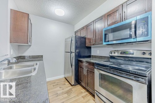 219 530 Watt Boulevard, Edmonton, AB - Indoor Photo Showing Kitchen With Stainless Steel Kitchen With Double Sink
