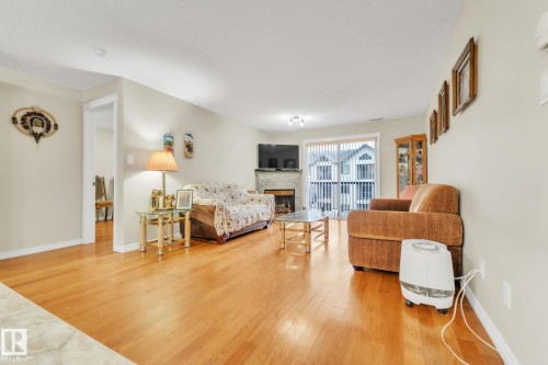 407 17407 99 Avenue, Edmonton, AB - Indoor Photo Showing Living Room With Fireplace