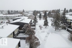 Snowy aerial view featuring a residential view - 