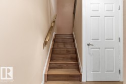Staircase with baseboards and wood finished floors - 