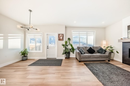 520 Bluff Lane, Leduc, AB - Indoor Photo Showing Living Room With Fireplace