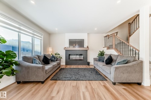 520 Bluff Lane, Leduc, AB - Indoor Photo Showing Living Room With Fireplace