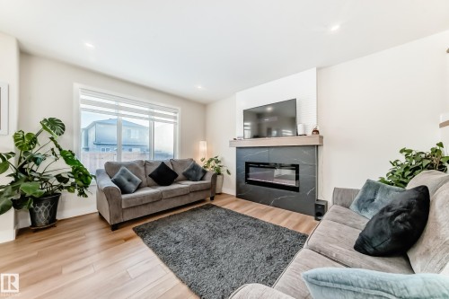 520 Bluff Lane, Leduc, AB - Indoor Photo Showing Living Room With Fireplace