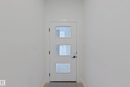 Entryway with baseboards - 3158 Magpie Way, Edmonton, AB - Indoor Photo Showing Other Room
