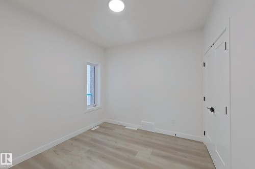 Empty room featuring light wood-type flooring and baseboards - 3158 Magpie Way, Edmonton, AB - Indoor Photo Showing Other Room