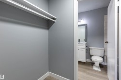 Bathroom with light wood-style flooring and vanity - 