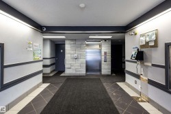 Building lobby featuring a textured ceiling - 