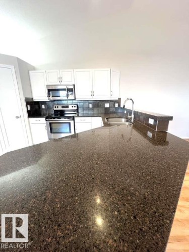 12 303 Leger Way, Edmonton, AB - Indoor Photo Showing Kitchen With Double Sink