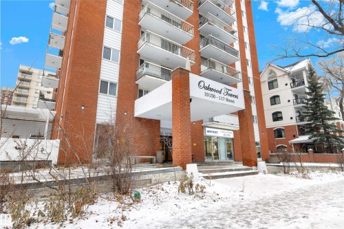 Snow covered building featuring a view of apartment building / complex - 1702 10150 117 Street, Edmonton, AB - Outdoor With Balcony