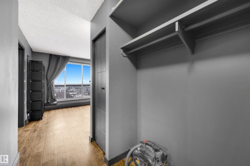 Entry closet featuring wood-style flooring - 1702 10150 117 Street, Edmonton, AB - Indoor Photo Showing Other Room