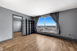 Spare room featuring a textured ceiling, light wood finished floors, and baseboard heating - 