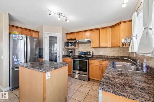 3913 159 Avenue, Edmonton, AB - Indoor Photo Showing Kitchen With Double Sink