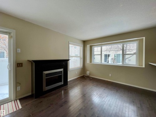78 230 Edwards Drive Sw, Edmonton, AB - Indoor Photo Showing Living Room With Fireplace