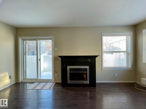 78 230 Edwards Drive Sw, Edmonton, AB - Indoor Photo Showing Living Room With Fireplace