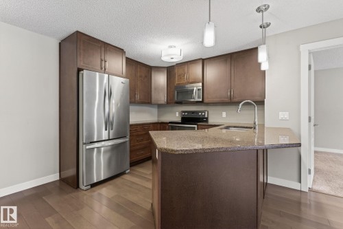 104 2207 44 Avenue Nw, Edmonton, AB - Indoor Photo Showing Kitchen With Stainless Steel Kitchen