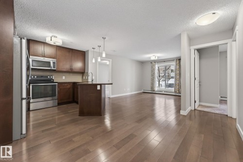 104 2207 44 Avenue Nw, Edmonton, AB - Indoor Photo Showing Kitchen With Stainless Steel Kitchen