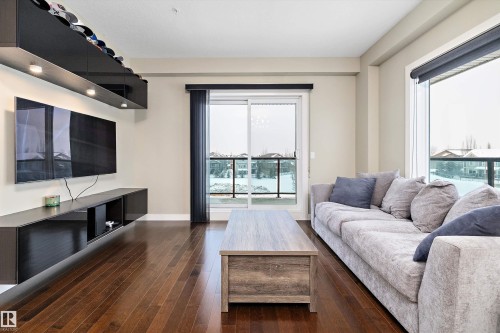 306 1230 Windermere Way, Edmonton, AB - Indoor Photo Showing Living Room