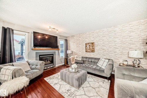 5819 Sutter Place, Edmonton, AB - Indoor Photo Showing Living Room With Fireplace