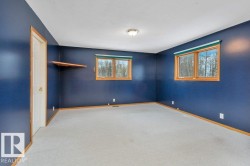 Unfurnished bedroom with carpet floors and baseboards - 