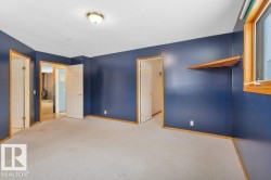 Unfurnished bedroom featuring carpet flooring and baseboards - 