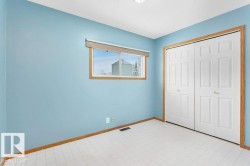 Unfurnished bedroom with a closet and light floors - 