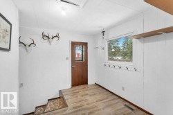 Entryway with light wood-type flooring and baseboards - 