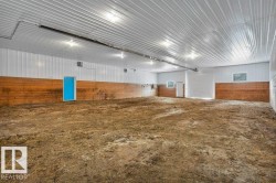 Misc room with metal wall and concrete floors - 