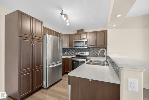 343 11505 Ellerslie Road, Edmonton, AB - Indoor Photo Showing Kitchen With Double Sink