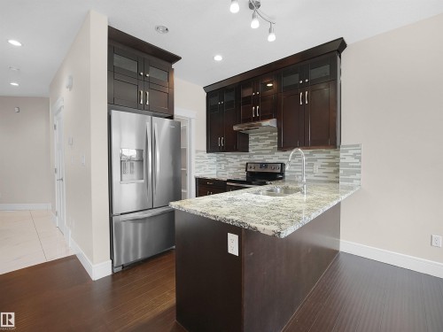 8579 Cushing Place, Edmonton, AB - Indoor Photo Showing Kitchen With Double Sink With Upgraded Kitchen
