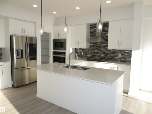 23 Sturtz Place, Leduc, AB - Indoor Photo Showing Kitchen With Double Sink With Upgraded Kitchen